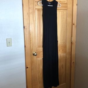 Lulus black maxi dress with pockets and slit down the side.